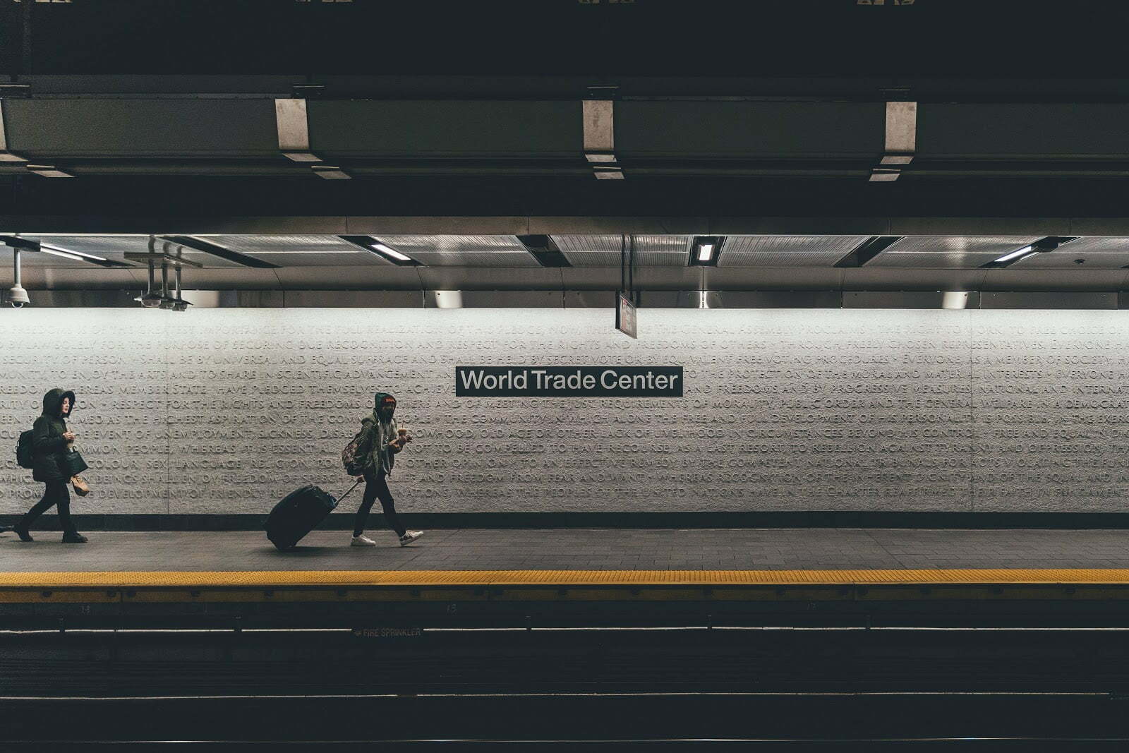 a person walking on a sidewalk