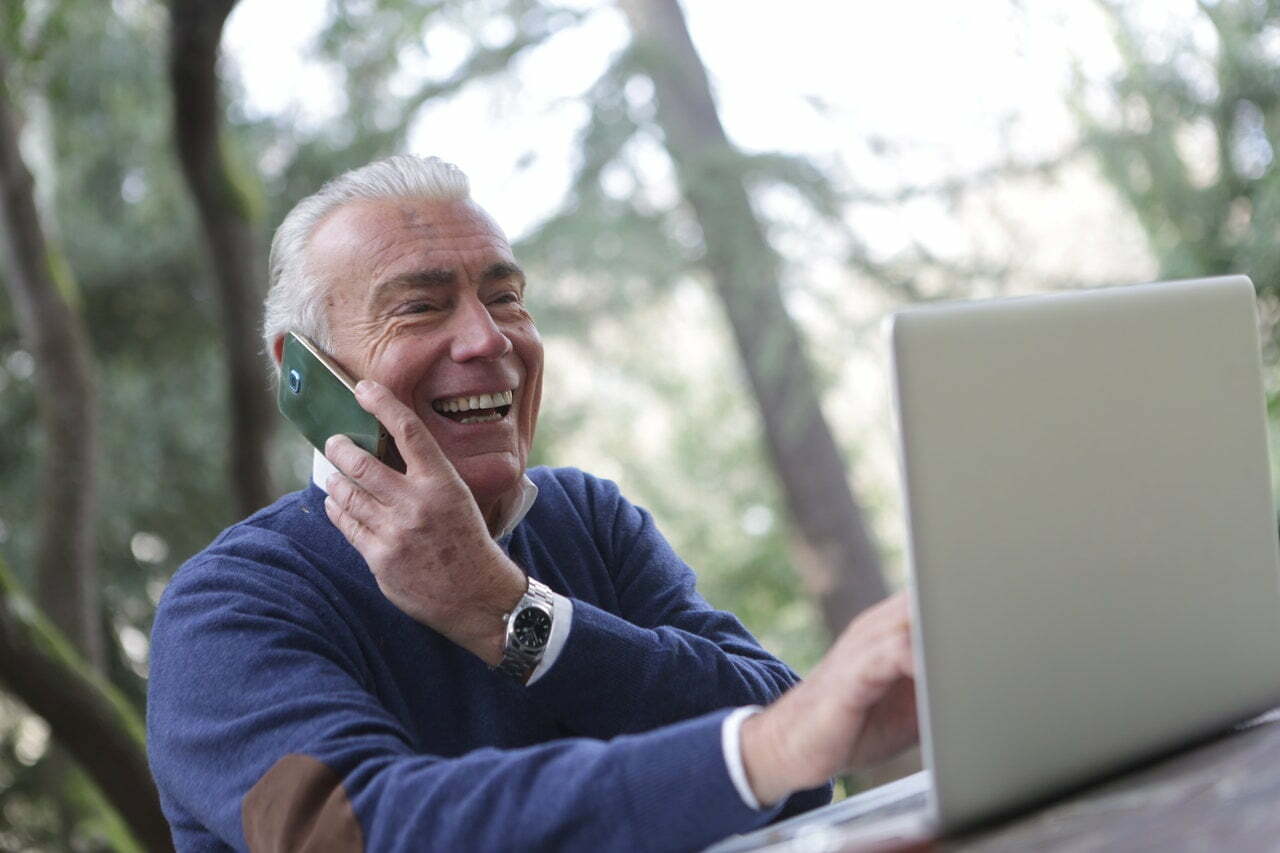 a man holding a laptop