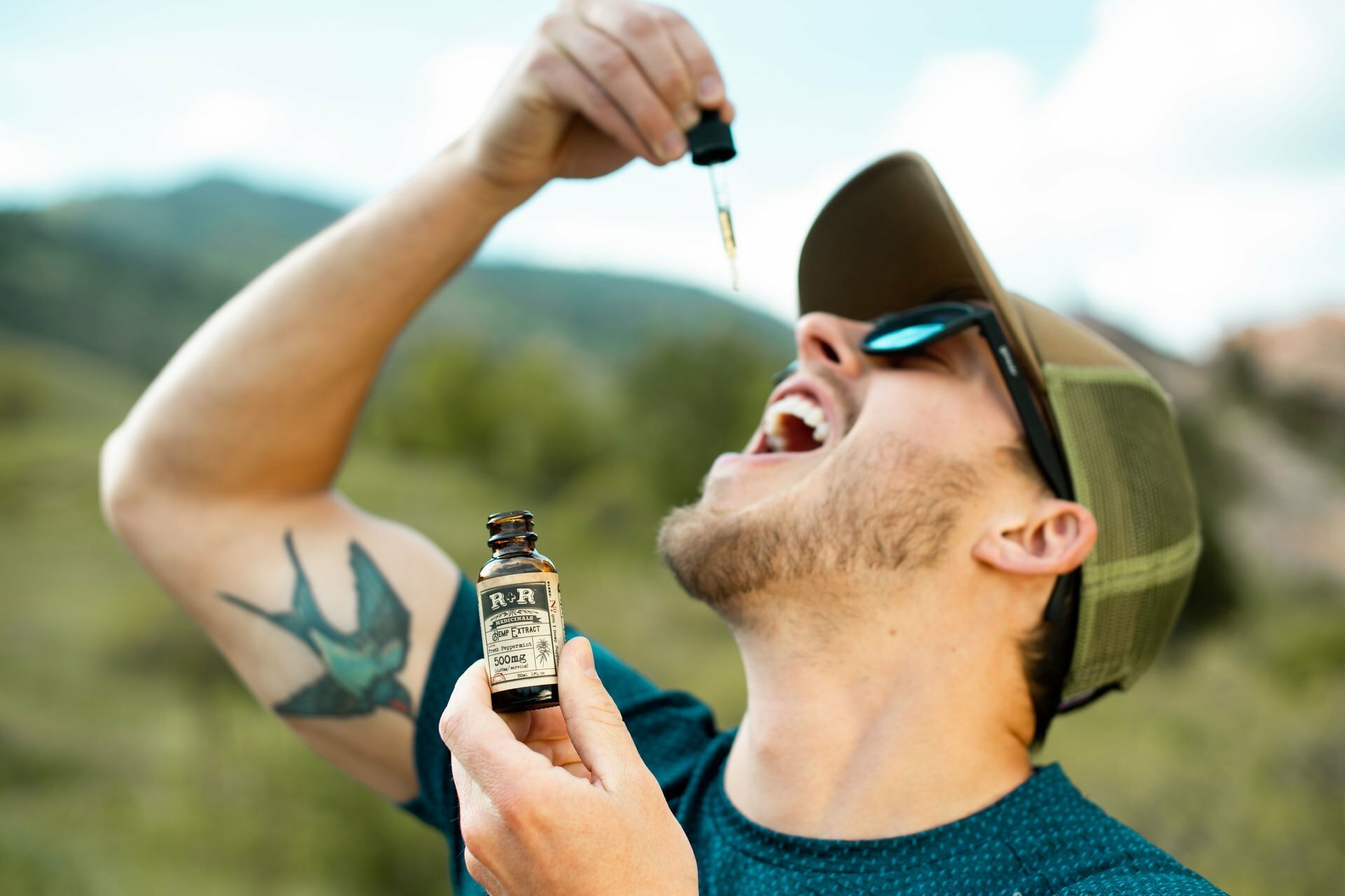 a man holding a bottle of beer