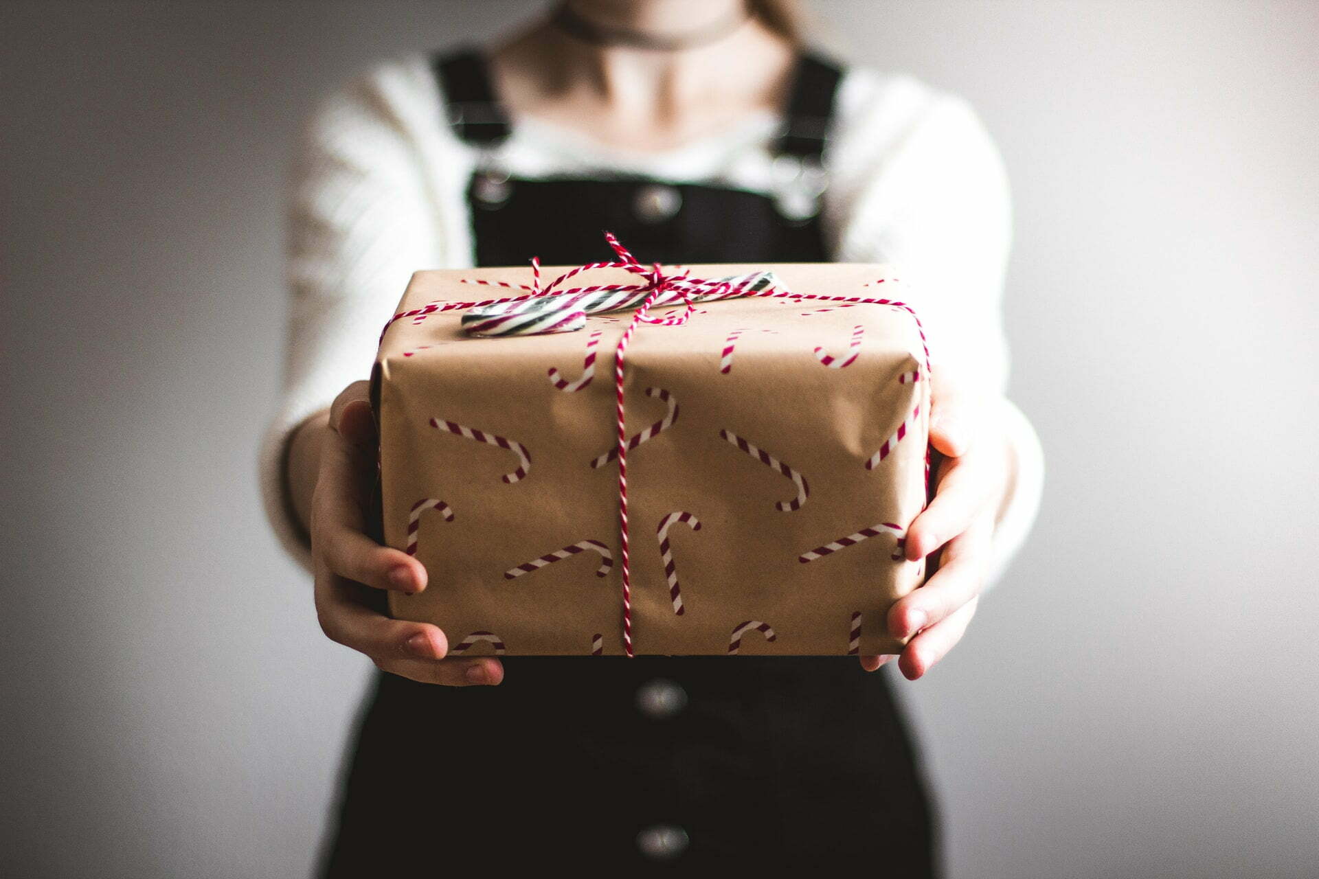 a person holding a cake