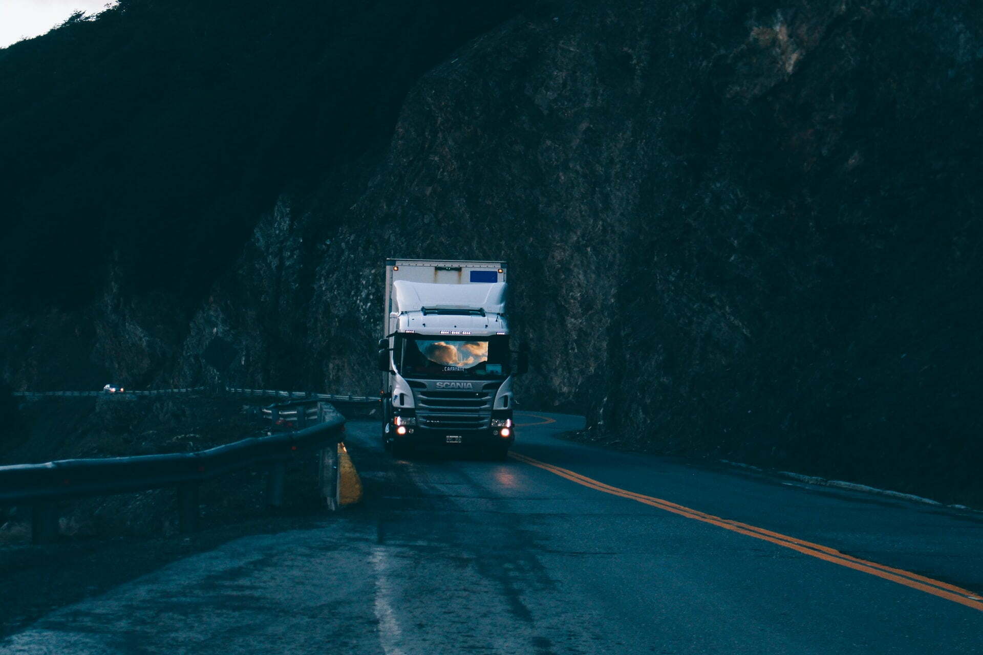 a truck driving on a road