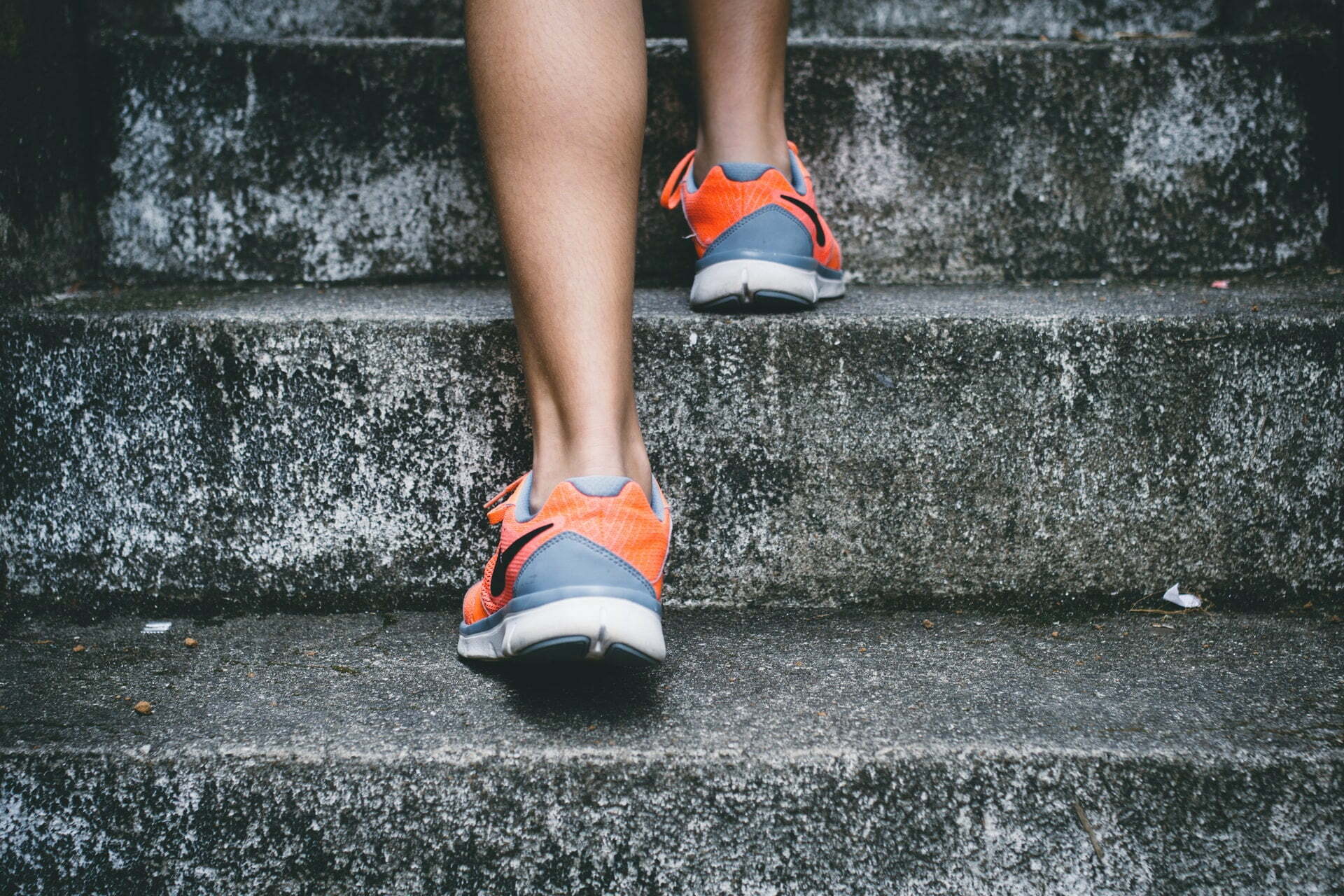 a person wearing red shoes