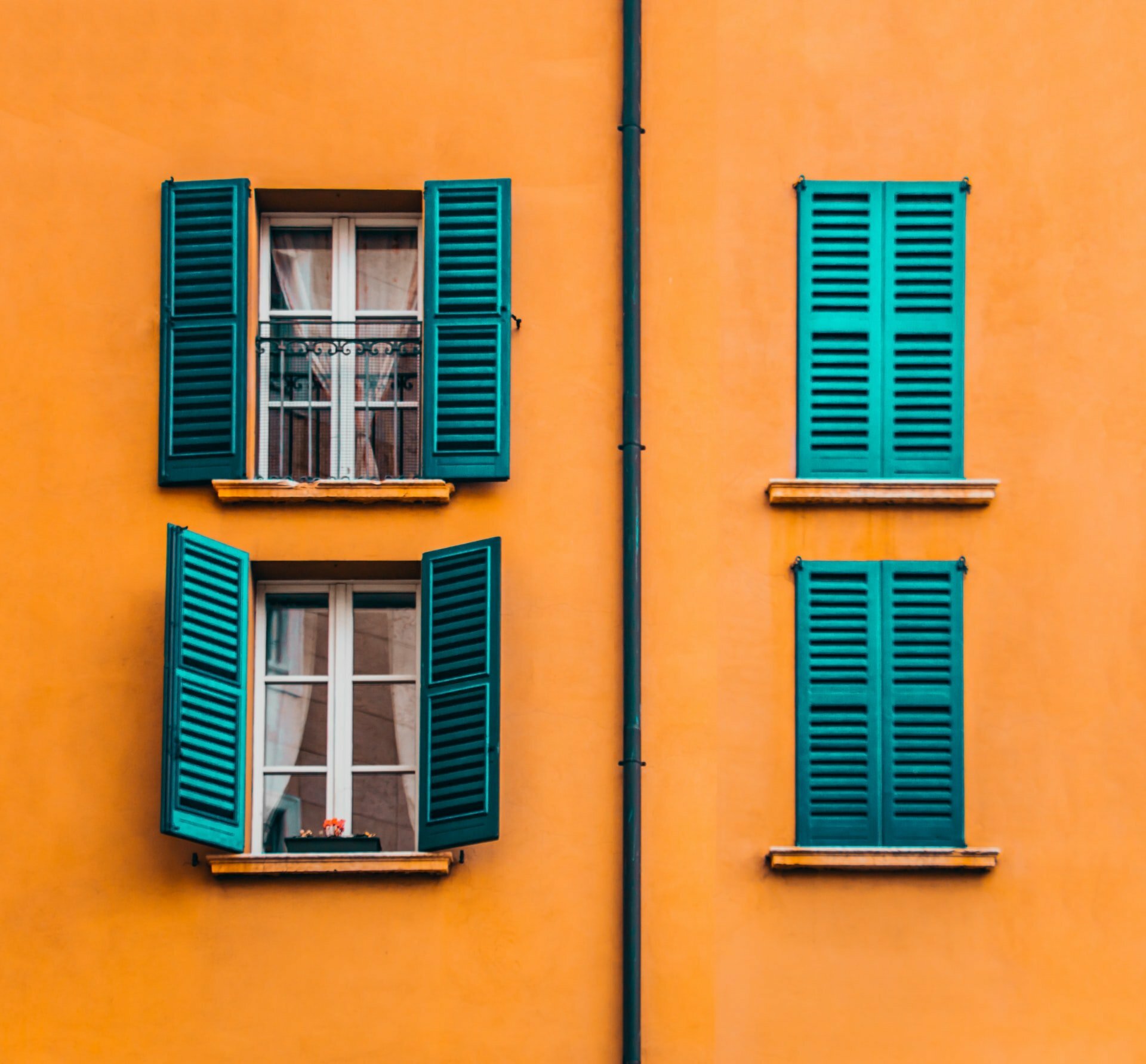 a yellow building with windows