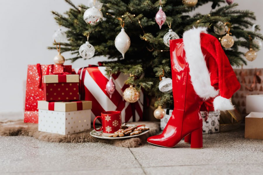 a christmas tree with presents underneath it