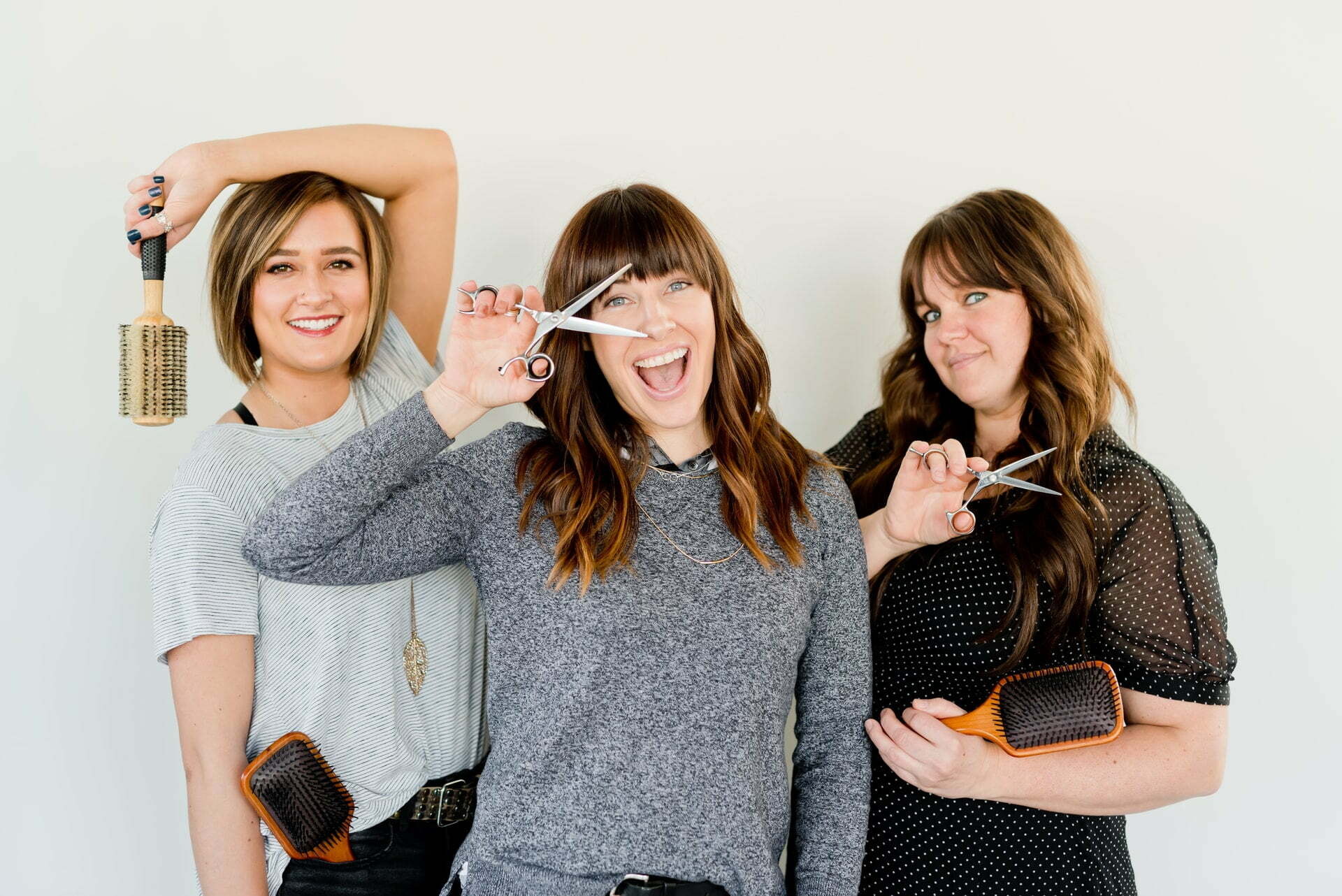 a group of women holding up a knife