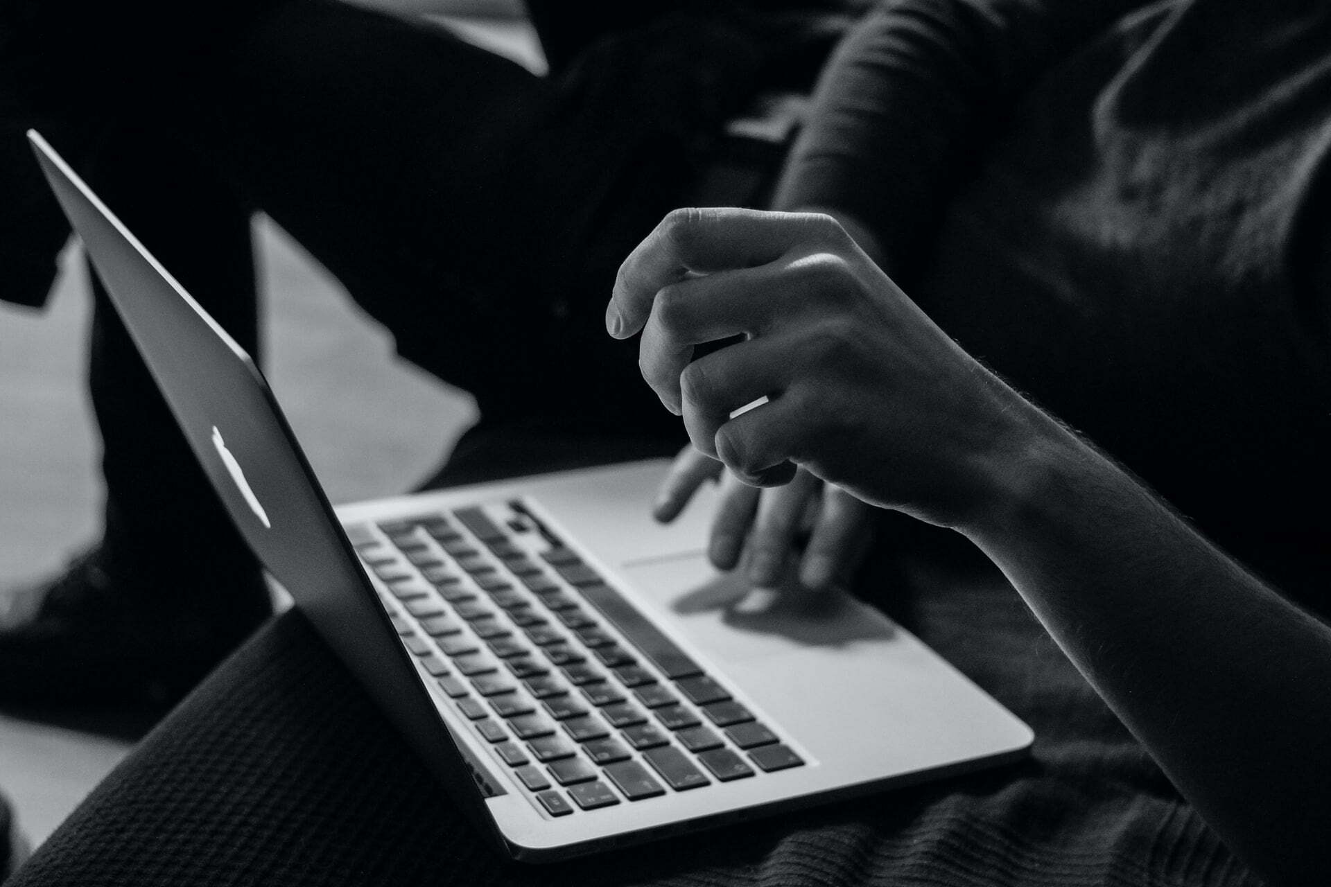 a person typing on a laptop