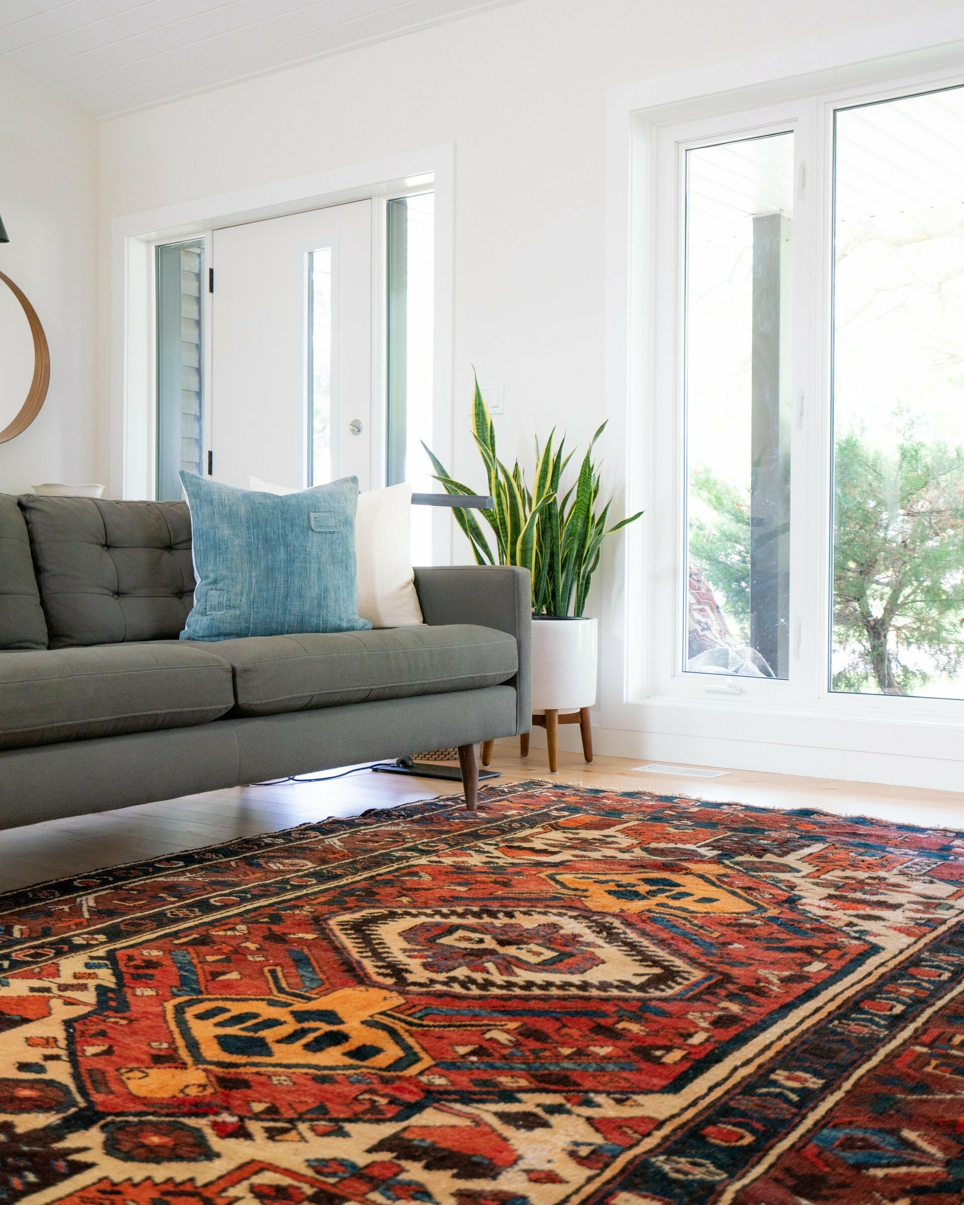 a living room with a couch and a rug