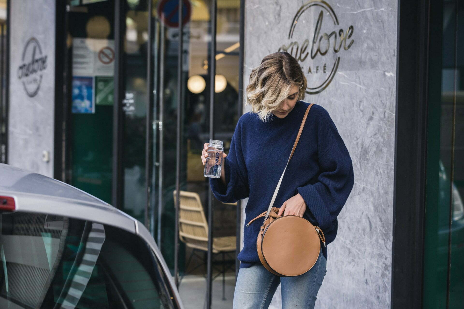 a person walking down a sidewalk