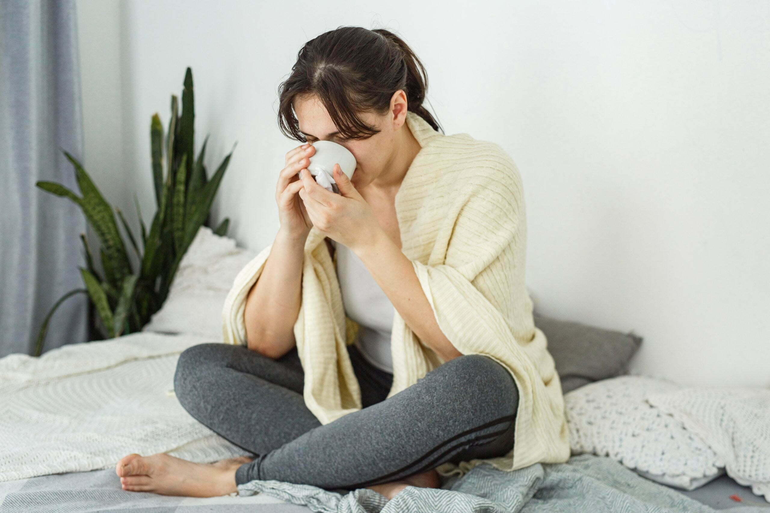 a woman sitting on a bed