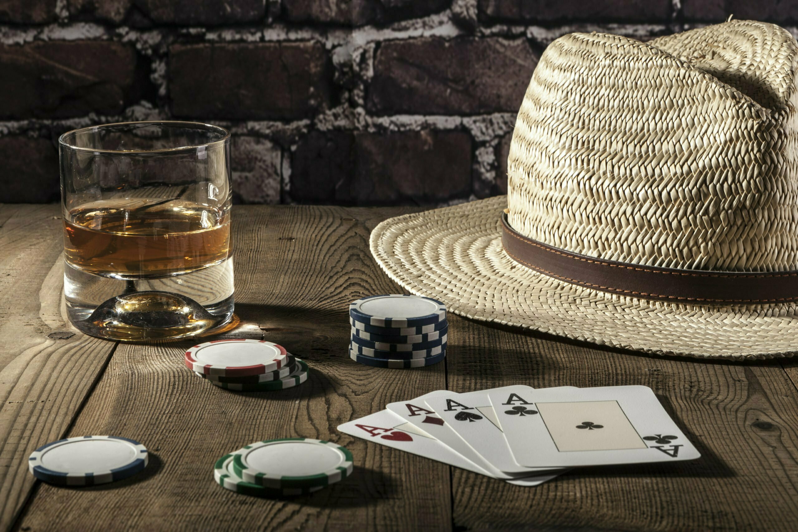 a table with a glass of water and a cigar